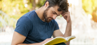 Person reading a book.