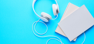White headphones against a blue background
