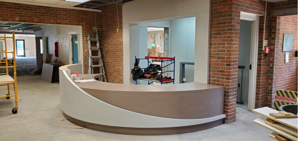 new circulation desk in place in unfinished lobby